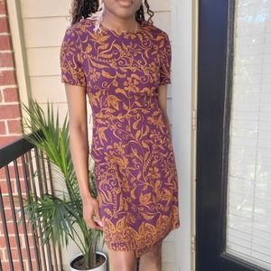 Size 2-4 vintage dress with wrap detail in front.